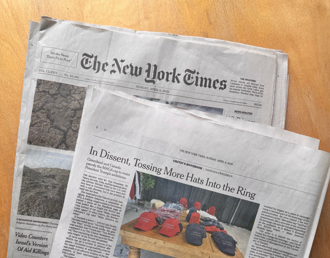 New York Times newspapers featuring a story about protest hats